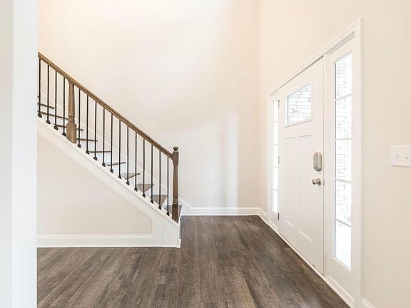 Upgrade your entry way with gorgeous metal twists and hardwood stair treads.