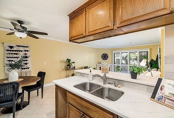 Kitchen view looking towards table and outside patio.
