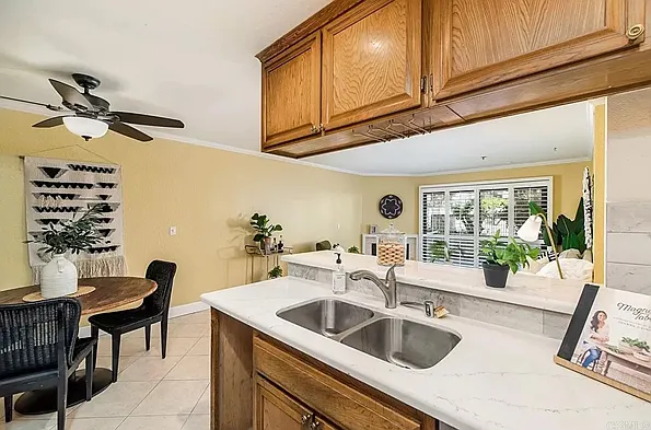 Kitchen view looking towards table and outside patio.