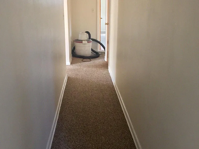 Hall way looking from Bedroom 1 & 2 towards Master