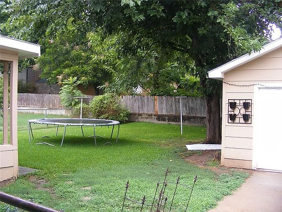 Shady fenced back yard