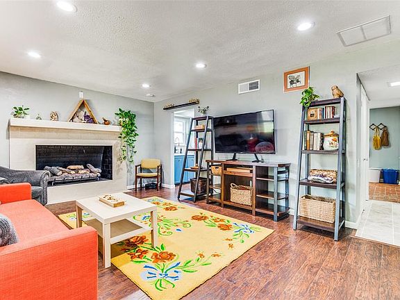 Living Area Opens to Kitchen and Front Entry Hall