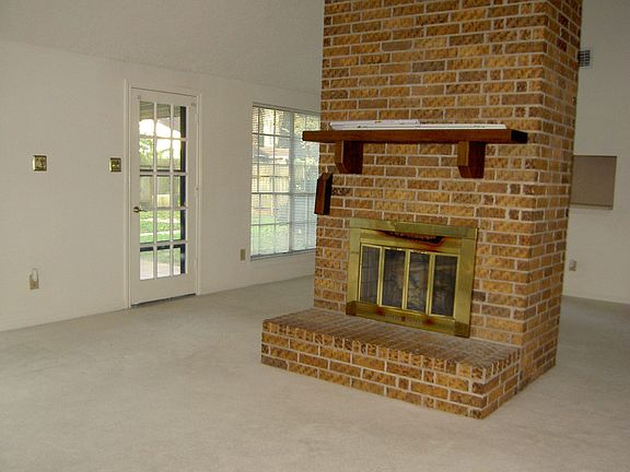 Family area with wood burning fireplace.