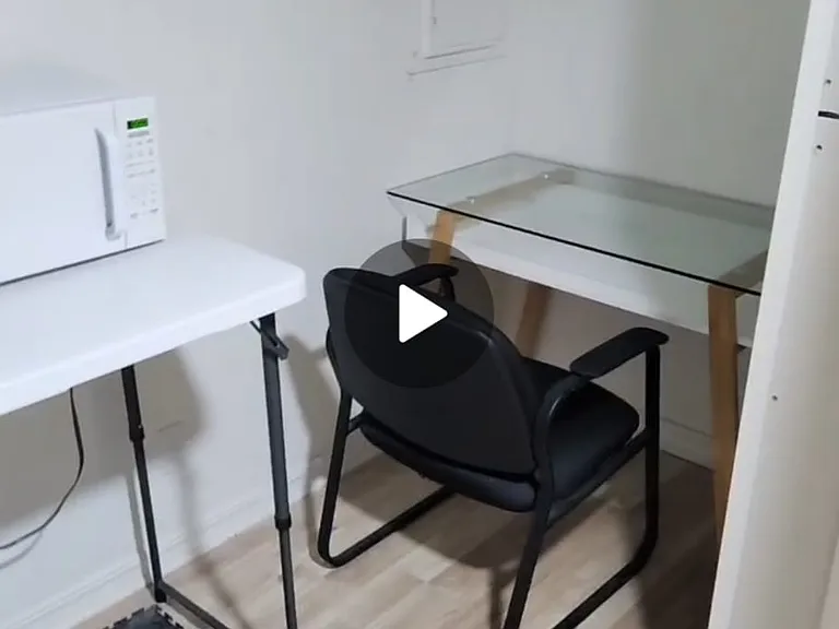 this photo shows the small study area in the small private room for rent for $499 + $150 for utilities with a shared bathroom across the hallway