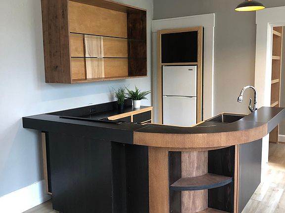 Kitchen with range, refrigerator, disposer.