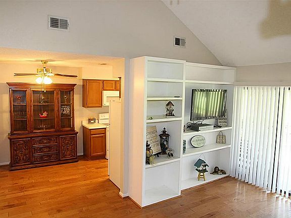 Dining is open to the kitchen and living rooms.