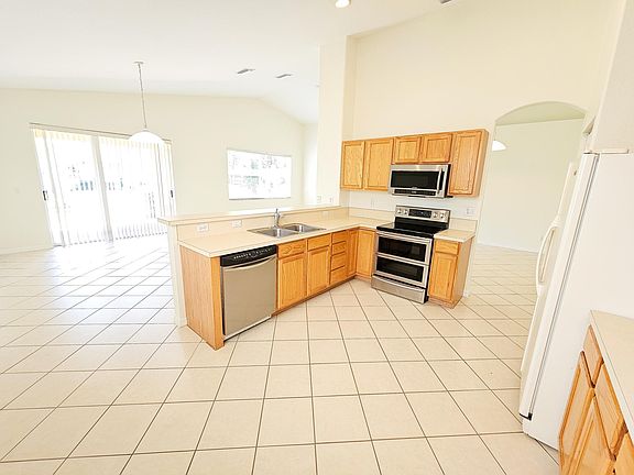 Open Floorplan flows into kitchen.