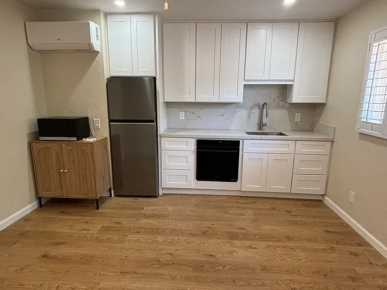 New paint, New LG Microwave, new LG refrigerator, New LG Oven, New Induction Cooktop Burner, new stainless steel sink and faucet with pull-out spray, New Cabinets - Black handles to be installed