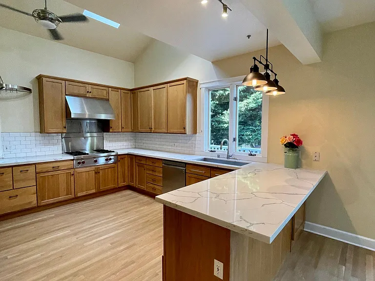 Gourmet farmhouse kitchen with Wolff, Bosch appliances.