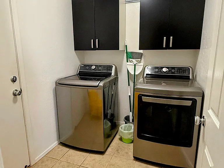 Laundry room connected to 2-car garage door entry.