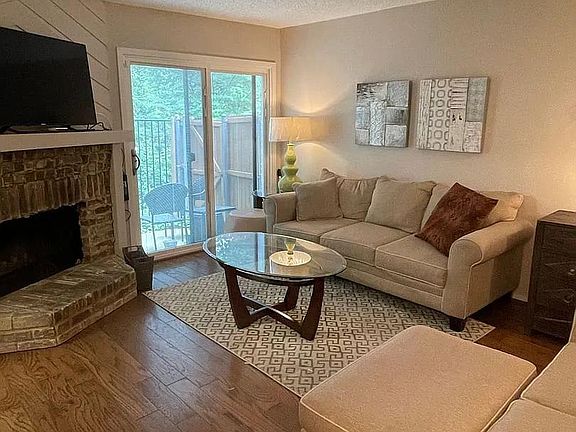 Living room. 

If furnished, includes pull out sofa, loveseat, ottoman, two end tables with lamps, coffee table, chest of drawers