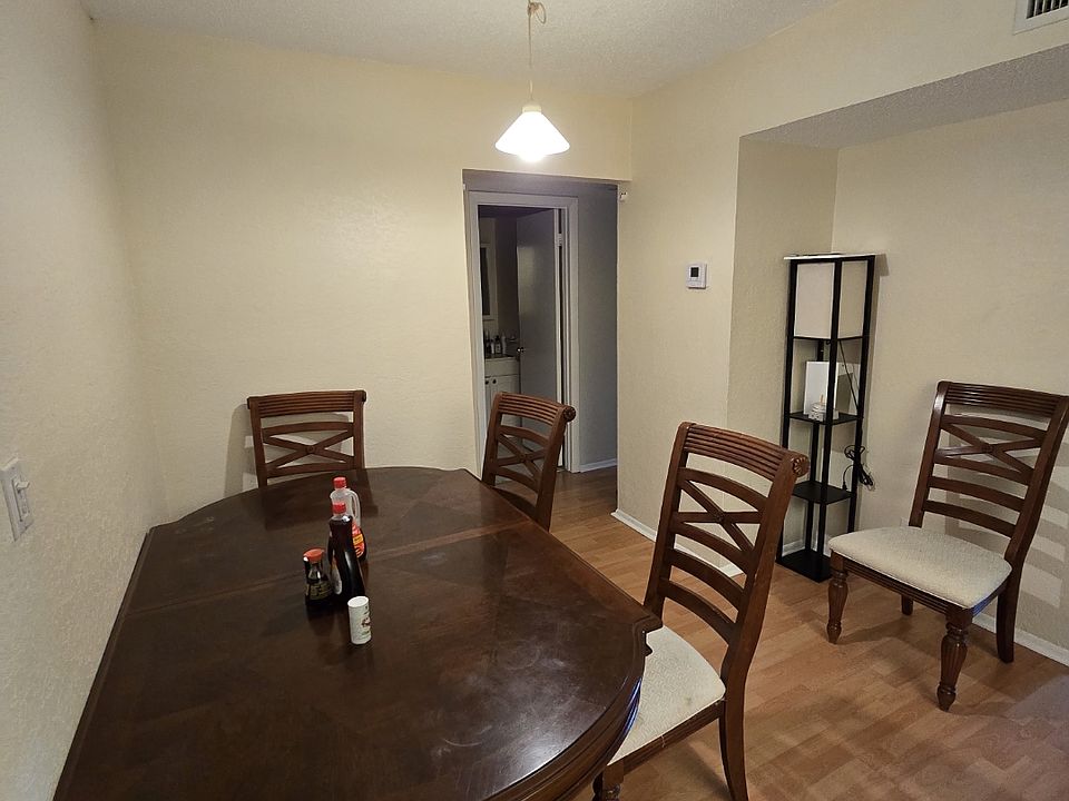 furnished dining room with table and chairs