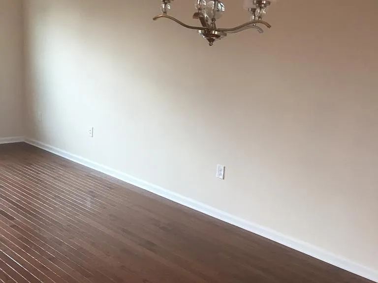 formal dining area with beautiful chandelier.