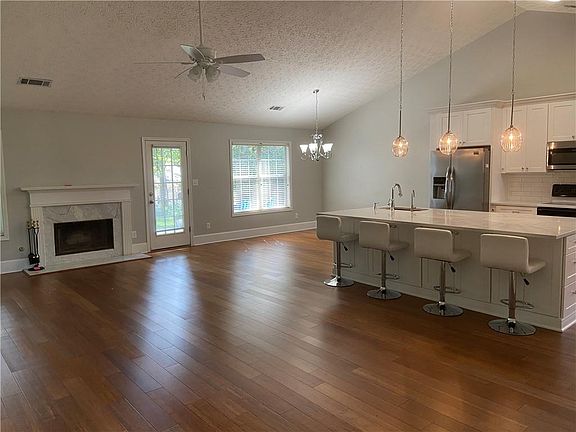 Open kitchen with huge beautiful island to the family and dining room