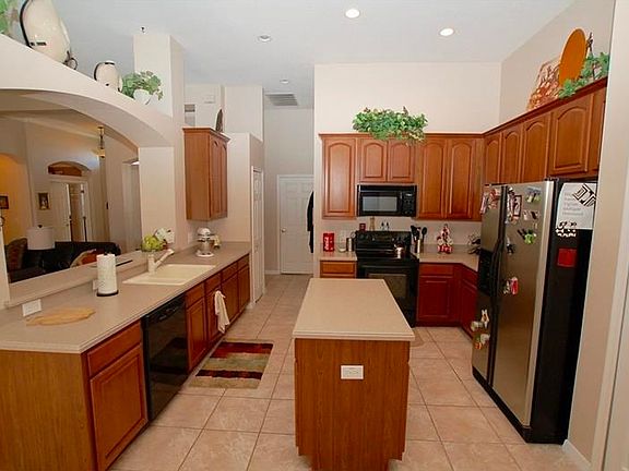 Large kitchen with Corian counters, chef's island, and 42" cabinets