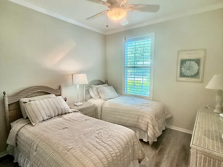 Guest bedroom, 2 twins, dresser. Guest bathroom just a step outside of bedroom.