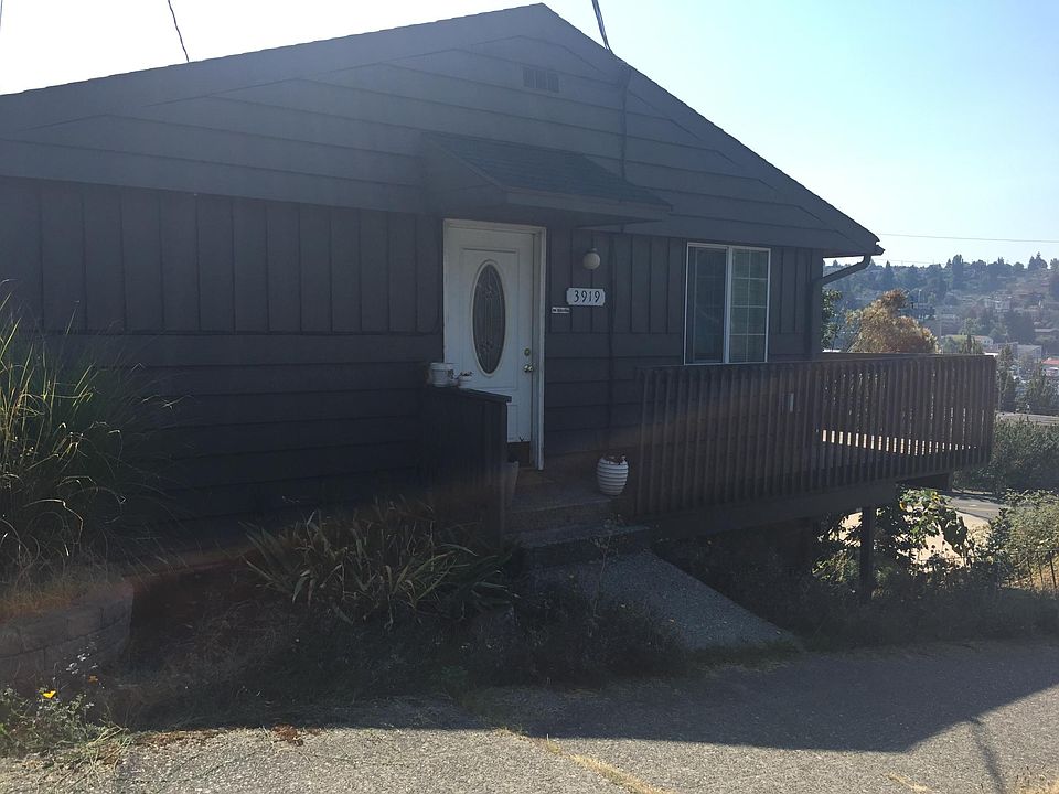 Front Entrance - Deck to the side facing west with salmon bay view below