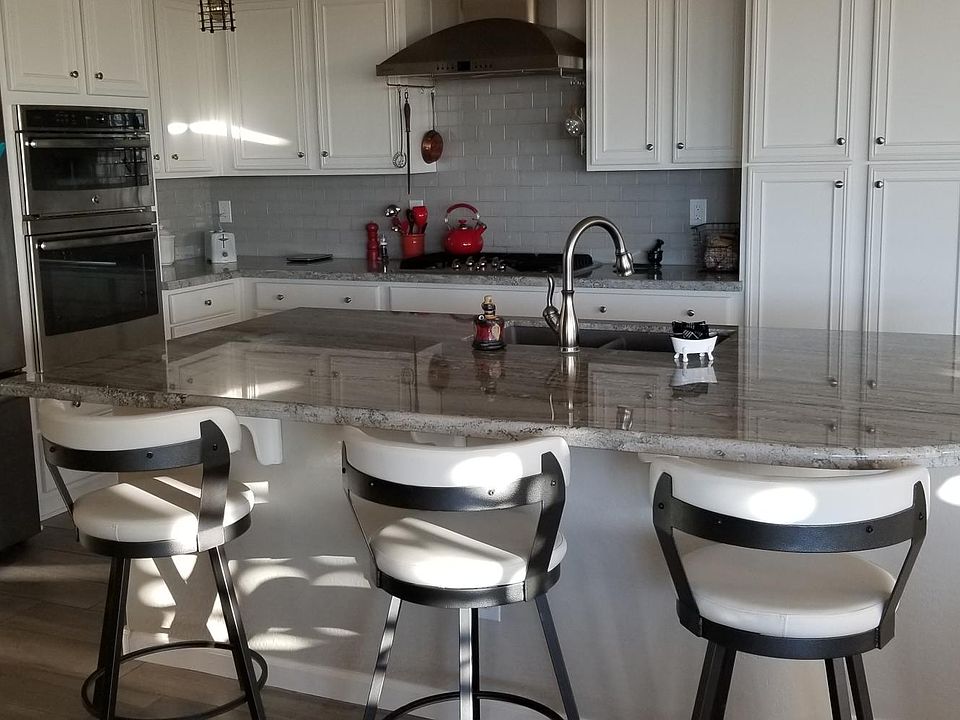 Kitchen area with bar stools