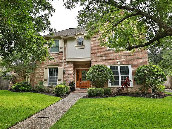 FOUR BEDROOMS WITH 3 FULL AND 1 HALF BATH - Located in the coveted subdivision of Wimbledon Estates, this 3444 sq ft Traditional home sits on beautifully manicured grounds with a large pool and mature trees.