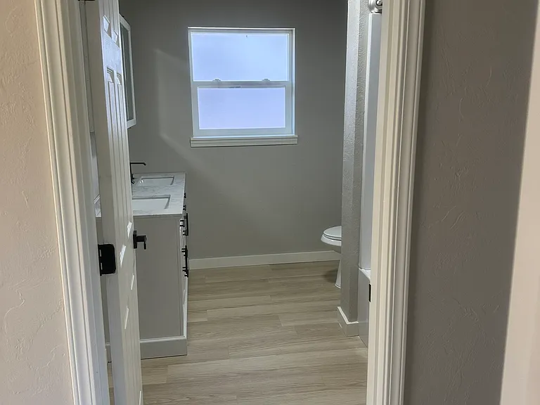 Hallway entrance to the expansive second bathroom