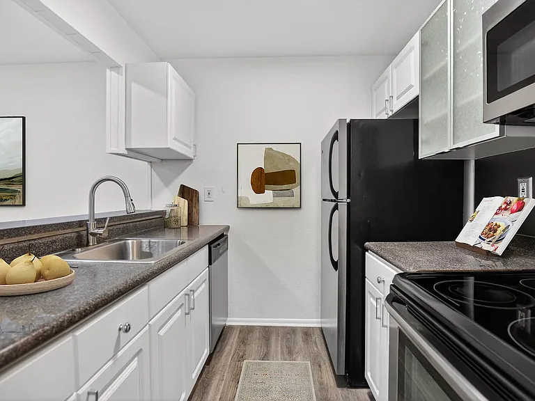 Elevate your lifestyle at The Woods at Ambler, an Eagle Rock Community. This modern kitchen features sleek appliances, ample storage, and a stylish design. Embrace comfort and convenience in your new home. Schedule a tour today!