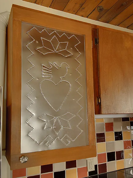 Close up of tinwork cabinet