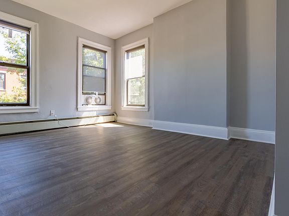 Spacious living room with 3 extra large windows