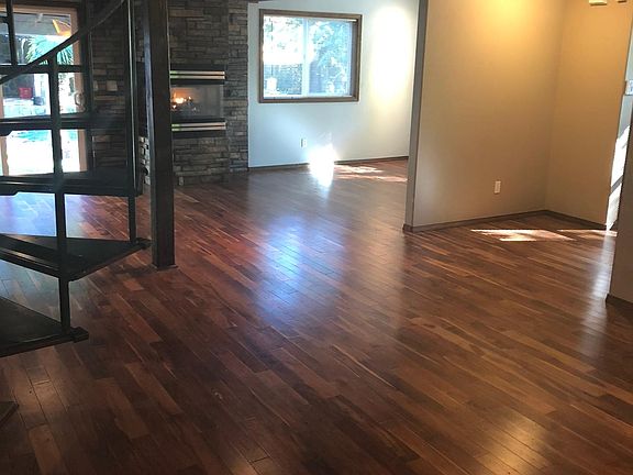 Living room view with a gas fireplace that heats the entire
