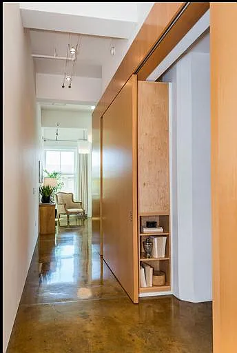 Condo corridor from main enterance leading down to living ro