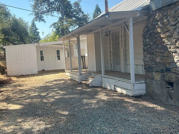 Side porch of dining area, end of driveway and shed
