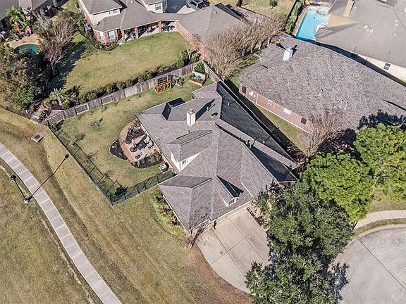 Perched on a spacious cul-de-sac lot with a partial iron & wood fence offers you amazing lake views and privacy from your backyard neighbors!