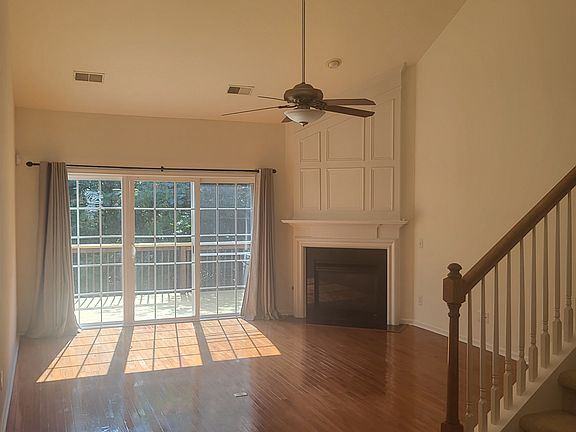 Livingroom, Gas fireplace, Ceiling fan, Entrance to deck, Room darkening curtains