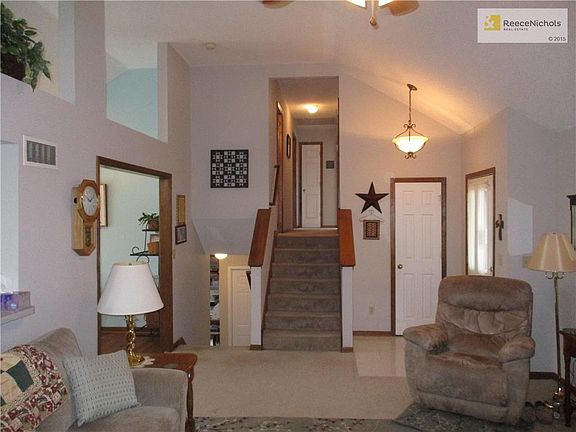 A view from the fireplace - the front door is on the right, as well as a coat closet off the tiled e