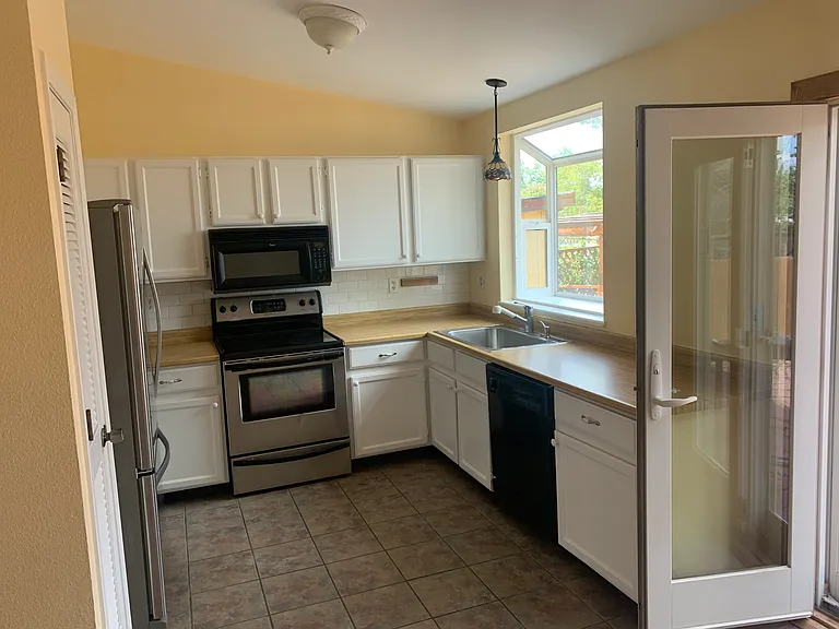 kitchen with bay window and view of the mountains