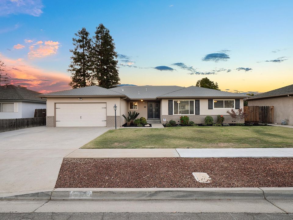 Lovely Exterior with Mature Landscaping and Decorative Shutters