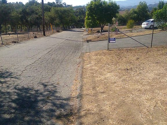 Keep going, look for the yellow 
chain and cones.