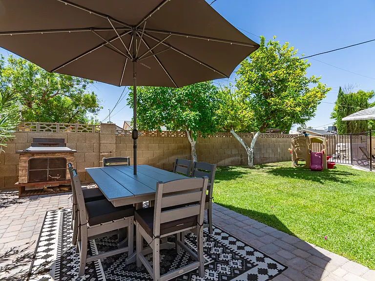 Outdoor dining for 6 and grassy area for kids/pups (Playset has been removed)