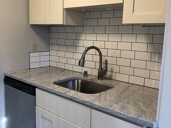 new kitchen will have identical cabinets and backsplash, but the new kitchen will be larger and will have a breakfast bar. See digital rendering