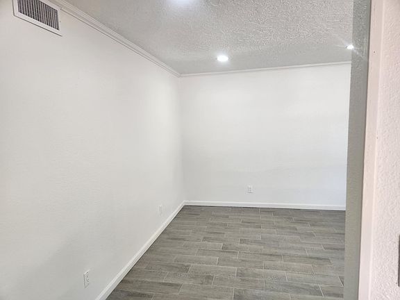 Inside front entry way facing entry to den/ formal dining rm.