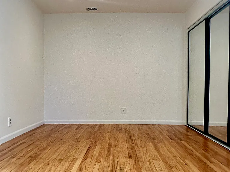 Bedroom with recessed lighting and ample closet space