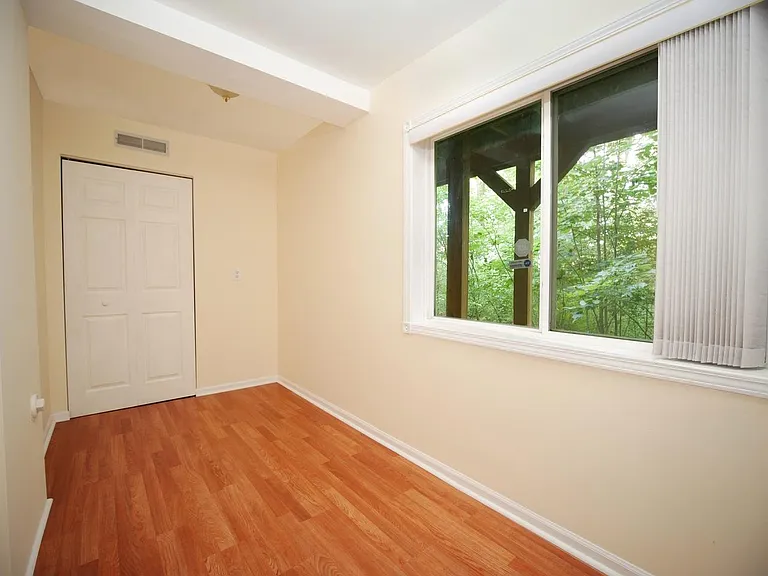 Den space for office-den-dining table backing to woods.