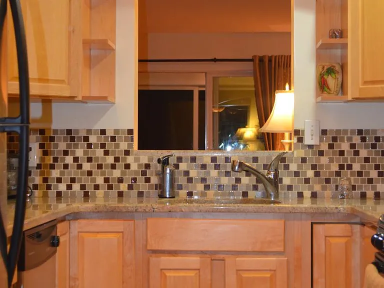 Kitchen with granite and stainless appliances