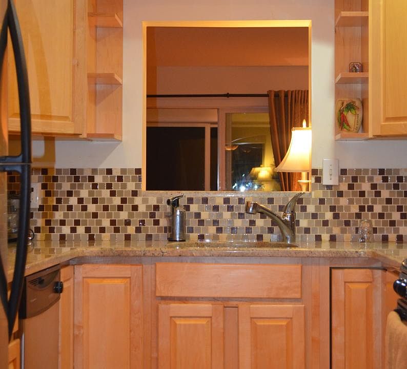 Kitchen with granite and stainless appliances