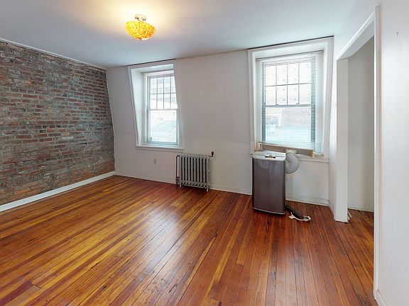 Dining room/3rd Bedroom with exposed brick.