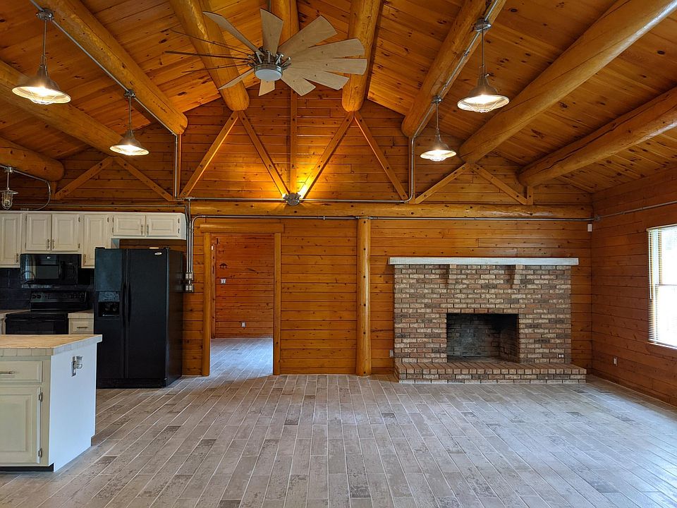 Open concept home with grand fireplace.