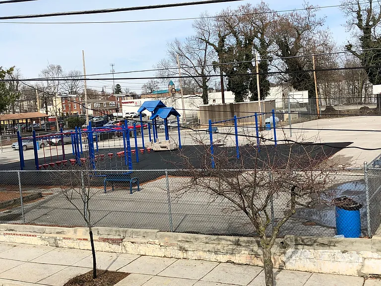 Park with basketball courts across the street.