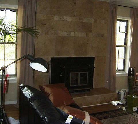 Family rm  custom travertine fireplace