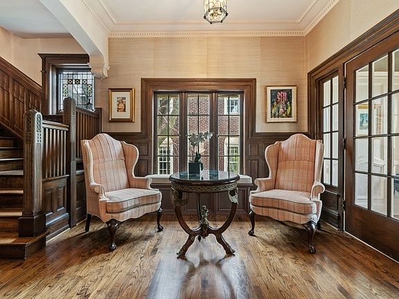 The foyer opens into a gallery space, accented by one of several window seats found throughout the 