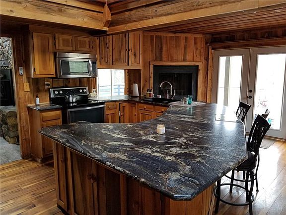 Fireplace in the corner...hardwood floors...what more could you ask for?