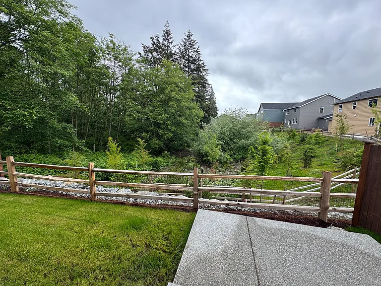 View from living / kitchen slider to patio back yard.